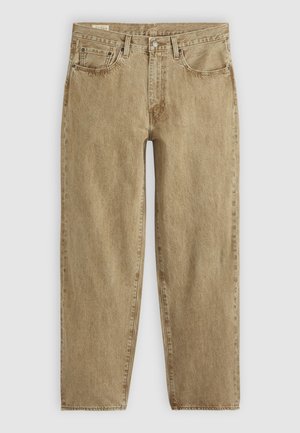 Beige denimjeans med avslappnad passform, femfickorsdesign, synlig sömnad och en något urtvättad yta; knapp- och dragkedjestängning.