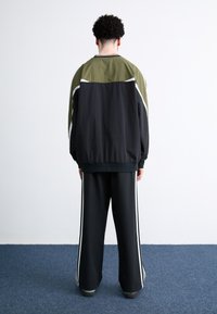adidas Originals Tracksuit bottoms - black