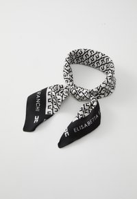 Silk scarf in black and white featuring a geometric pattern and logos. Triangular ends with a smooth, shiny texture.