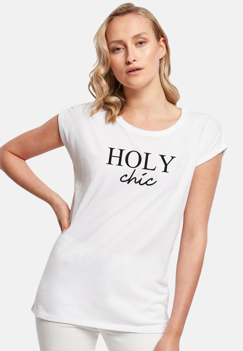White short-sleeve t-shirt with a round neckline, featuring the text "HOLY chic" in bold black lettering. Soft cotton material.