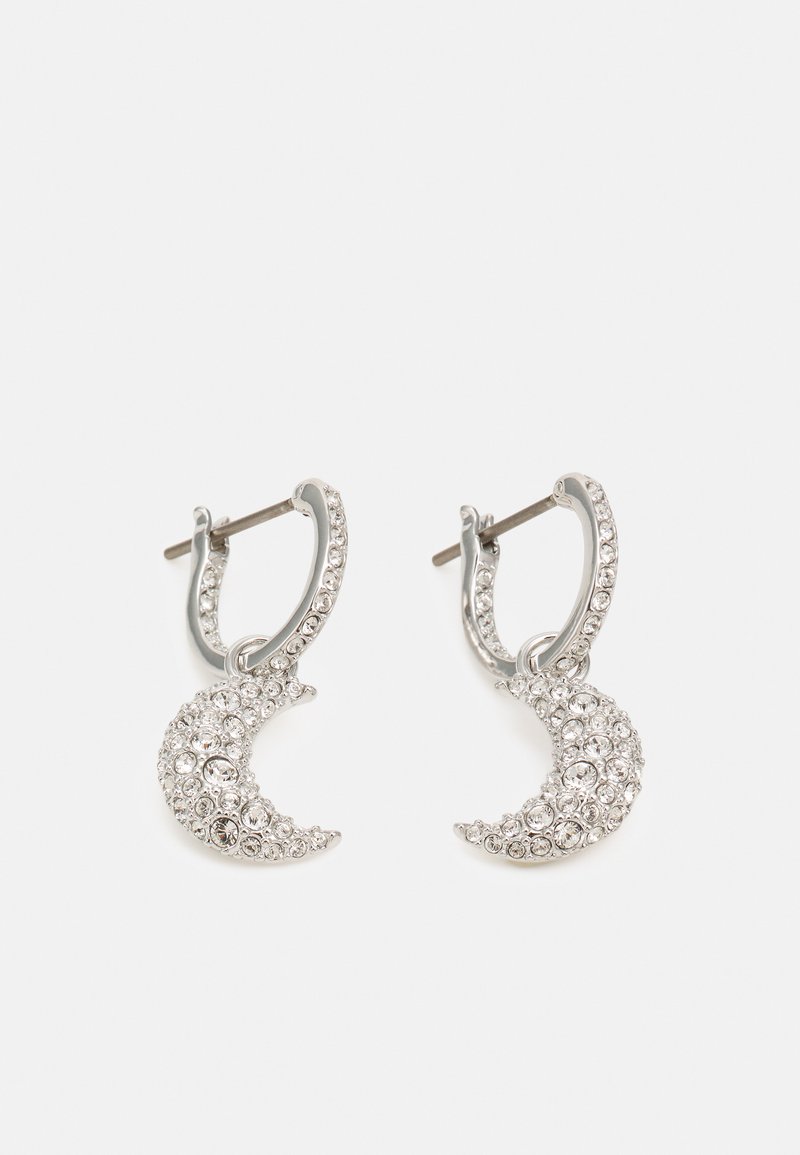 Boucles d'oreilles en argent avec des pendentifs en forme de croissant, ornées de gemmes transparents pour l'éclat et le détail.