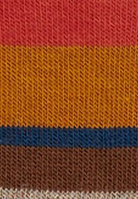 Multicolored knitted fabric with horizontal stripes in red, orange, yellow, blue, brown, and cream. Visible texture and pattern details.