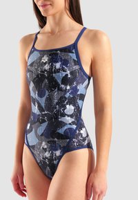 Maillot de bain une pièce bleu foncé avec un motif géométrique. Caractéristiques : bretelles fines et découpe haute sur les jambes. Fabriqué à partir d'un matériau lisse et extensible.