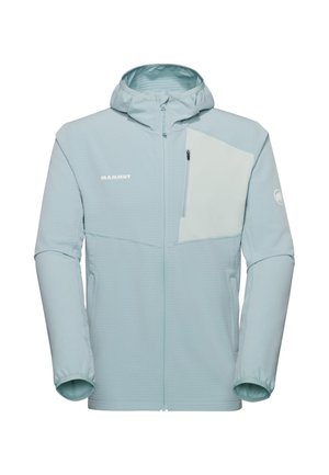 Veste à capuche bleu clair avec fermeture éclair avant, poche poitrine contrastante avec fermeture éclair, et logos Mammut sur la poitrine et la manche.