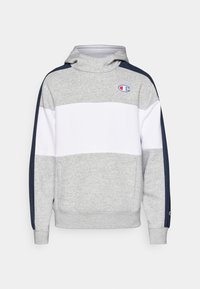 Sudadera gris con franjas horizontales blancas, paneles laterales azul marino y logotipo en el pecho. Fabricada en un tejido suave, cuenta con un cuello alto y puños acanalados.