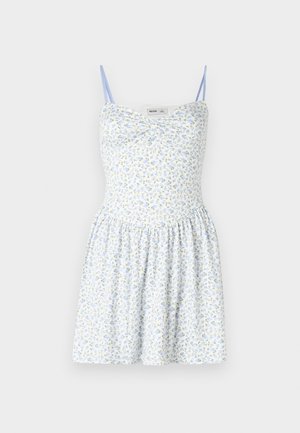 Lille lillelille sinine seljaga lilleline kleit, õhukeste rihmadega, kokkuvoodud seeliku ja kehakujuga. Omab väikeseid kollaseid ja siniseid lilli valgel taustal.