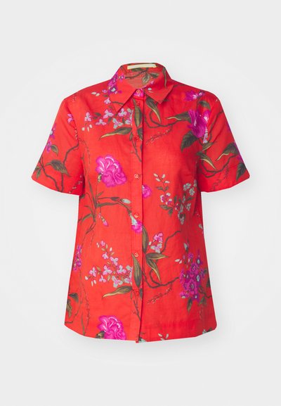 Red floral short-sleeve shirt featuring pink and purple flowers, green leaves, and a button-down front design with a classic collar.