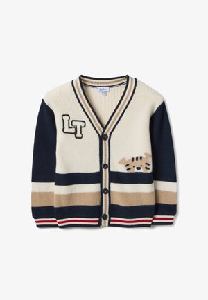 Gestreifte Strickjacke in Creme, Marineblau und Beige. Verfügt über einen V-Ausschnitt, Knopfleiste und eine Katzen-Grafik mit bestickten Akzenten auf der Vorderseite.