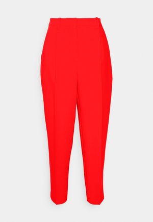 Red tailored trousers with a high waist, tapered leg, and creased front. Smooth fabric with no visible pockets or embellishments.