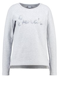 Sweatshirt gris à col rond, manches raglan longues, et logo texturé « Bench. » sur le devant. Tissu doux avec fentes en bas.