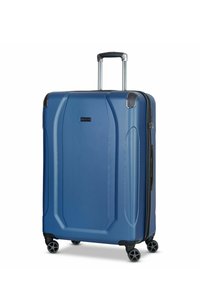 Valigia rigida blu con superficie texturizzata, manico retrattile e quattro ruote nere; presenta design a pannelli curvi e chiusura con zip.