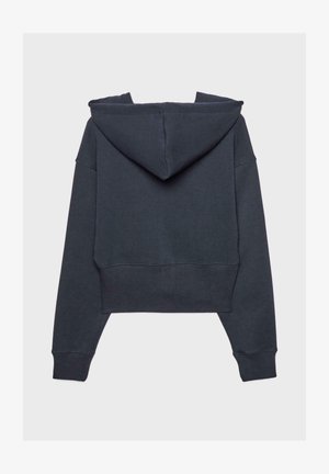 Cropped hoodie in dark gray, featuring a large hood, long sleeves, and ribbed hem. Made from soft, textured fabric.