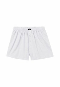 Men’s white cotton boxer shorts with elastic waistband and front button closure against white background.
