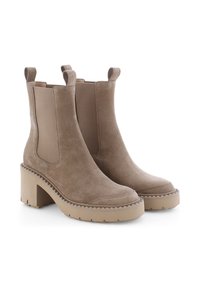 Beige suede ankle boots with elastic side panels, square toe, and chunky textured heel. Features pull loops for easy wear.