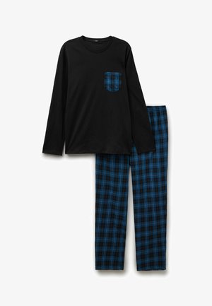 Haut noir à manches longues avec poche poitrine en flanelle à carreaux bleu et noir, associé à un pantalon de pyjama assorti à carreaux bleu et noir.