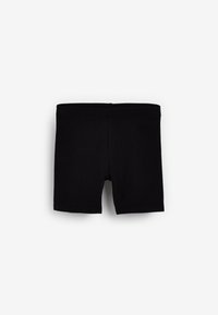 Boxers en coton noir avec une texture lisse, présentant un design simple et une taille élastique, sans motifs ni logos visibles.