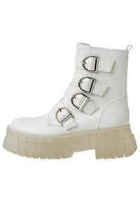 White ankle boot with four adjustable silver buckles, made from synthetic leather, featuring a chunky transparent sole and rounded toe.