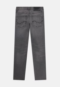Gray denim jeans with a straight cut, featuring two back pockets with decorative stitching and a branded fabric patch at the waistband.