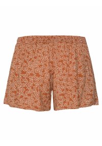 Shorts orange rouille avec une ceinture élastique, présentant un motif floral abstrait blanc intégral sur un tissu léger.