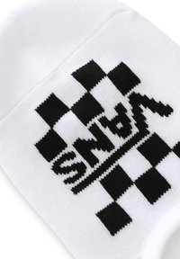 Calcetín de algodón blanco con un patrón de tablero de ajedrez negro y el logo "VANS" en letras negritas y estilizadas integradas en el diseño.