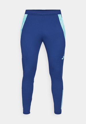 Marineblaue Sportleggings aus dehnbarem Material, mit hellblauen Seitenpanelen und einer taillierten Passform sowie einem schmalen Bündchen am Knöchel.
