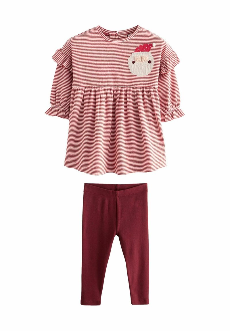 Röd och vit randig topp med volangärmar och en patch med en tomteansikte, tillsammans med enfärgade bordeaux leggings. Tillverkad av bomull, avslappnad passform.