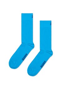 Niebieskie bawełniane skarpety typu crew o gładkiej fakturze. Na każdym skarpecie wydrukowano ciemnoniebieskie słowo „HAPPY”.