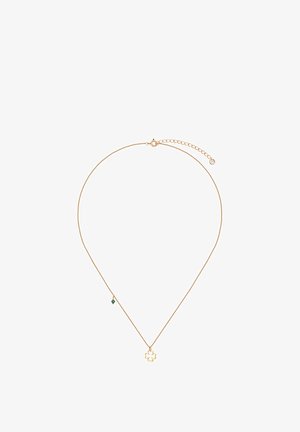 Złoty naszyjnik z zawieszką w kształcie koniczyny oraz małym zielonym koralikiem. Cienki łańcuszek z regulowanym zapięciem do dostosowania długości.