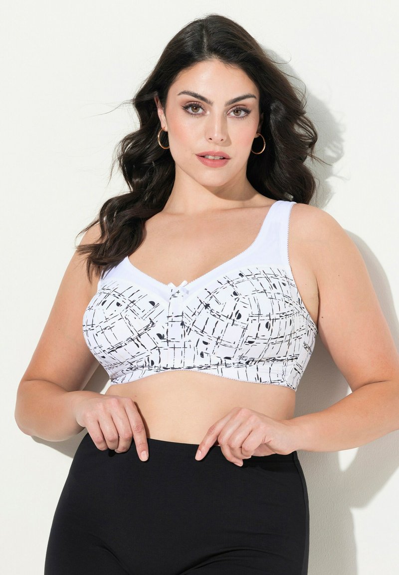 Bílý bralet má geometrický černý vzor, přizpůsobený design se širokými ramínky a předním zapínáním na knoflík. Černé vysoké spodní díly.