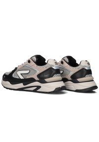 Black, beige, and white sneaker with mesh panels, a padded collar, thick rubber sole, and unique wave pattern on the outsole.