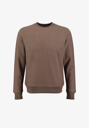 Sudadera marrón de canalé con cuello redondo, mangas largas y un corte ligeramente holgado; presenta un discreto parche con logo en el dobladillo.