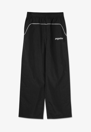 Calças desportivas pretas com cintura elástica e bainhas cinzentas ao longo dos bolsos. Apresenta um logótipo em branco no lado esquerdo.