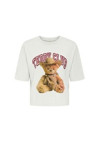 Biała, krótka koszulka z grafiką misia w kowbojskim kapeluszu. Napisa "Teddy Club" w ciemnoczerwonym kolorze znajduje się nad misiem.