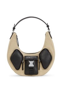 Hobo bag in beige canvas with black leather accents, featuring dual front zip pockets and a logo plaque. Curved shape with adjustable strap.