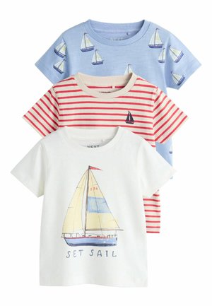 Three child-sized T-shirts: one light blue with sailboat prints, one red striped with small sailboat, and one white with a sailboat graphic and text.