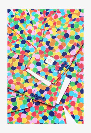 Värvilised ülikonna jakid, millel on elav ringikujuline muster punase, rohelise, sinise, kollase ja roosa värviga, kontrastsete siniste nuppude ja siltidega.