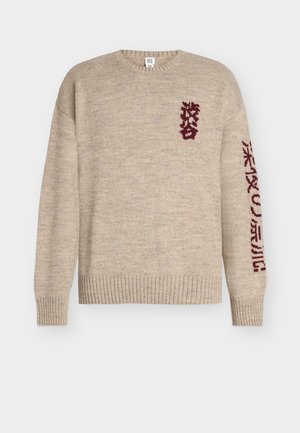 Stickad tröja - tan