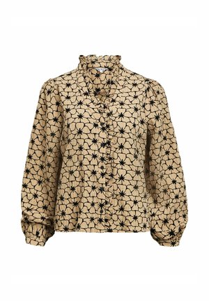 Blusa de manga larga en tejido beige con patrones florales negros, que presenta un cuello con volantes y cierre de botones, con mangas gathered.