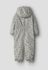 Mono infantil gris claro con estampado de dinosaurios, cinturilla elástica, capucha y puños, fabricado con un material resistente al agua.