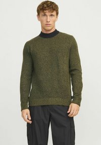 Green knitted sweater with a textured finish, contrasting navy ribbed collar, and regular fit. Sleeves are long and cuffs are ribbed.