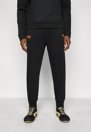 UFC ZENITH REPLICA MENS JOGGER - Pantalones deportivos - black/gold-coloured