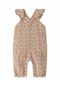 Smėlio spalvos kombinezonas su baltais gėlių siuvinėjimais, raukšlėtomis petnešėlėmis, mediniais mygtukais ir elastinėmis rankogaliais. Komplekte yra šoninės kišenės ir laisvas siluetas.