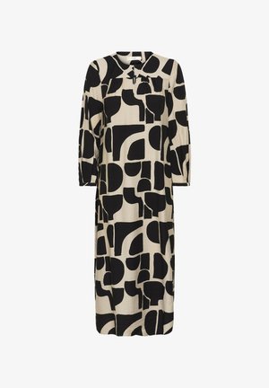 Beiges Midikleid mit langen Ärmeln, abstraktem Muster aus schwarzen geometrischen Formen, rundem Ausschnitt und leichten Falten unter dem Passe.