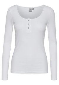 Top bianco a maniche lunghe in tessuto a coste, con scollatura a girocollo e una patta con tre bottoni sul petto, dotato di una silhouette aderente e texture liscia.