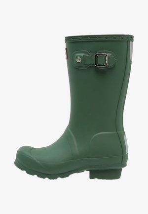Green rubber rain boot featuring a buckle detail and a textured sole. The design includes a rounded toe and a slightly raised heel.