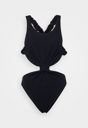Black one-piece swimsuit with a textured fabric, featuring a crisscross strap design and gathered accents on the sides and waist.
