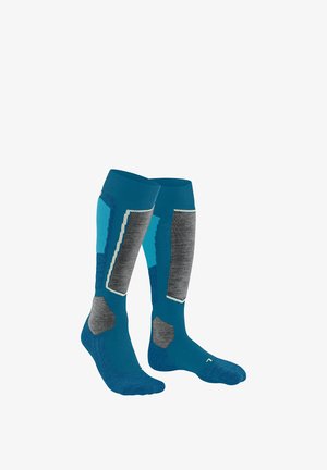 Calze al ginocchio in teal, grigio e azzurro chiaro. Presentano motivi testurizzati e sezioni rinforzate. Realizzate in materiale elasticizzato e traspirante.