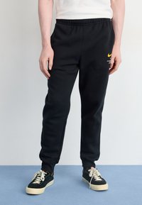 Nike Sportswear JOGGER   - Treniņtērpa apakšdaļas - black