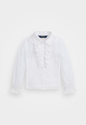 Blusa blanca de manga larga con volantes en la parte delantera y en los puños, diseño con botones y cuello clásico con borde de encaje.