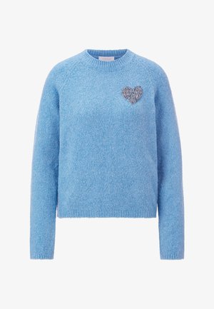 Blue knitted sweater with a round neck, long sleeves, and a textured finish. Features a silver heart embellishment on the chest.